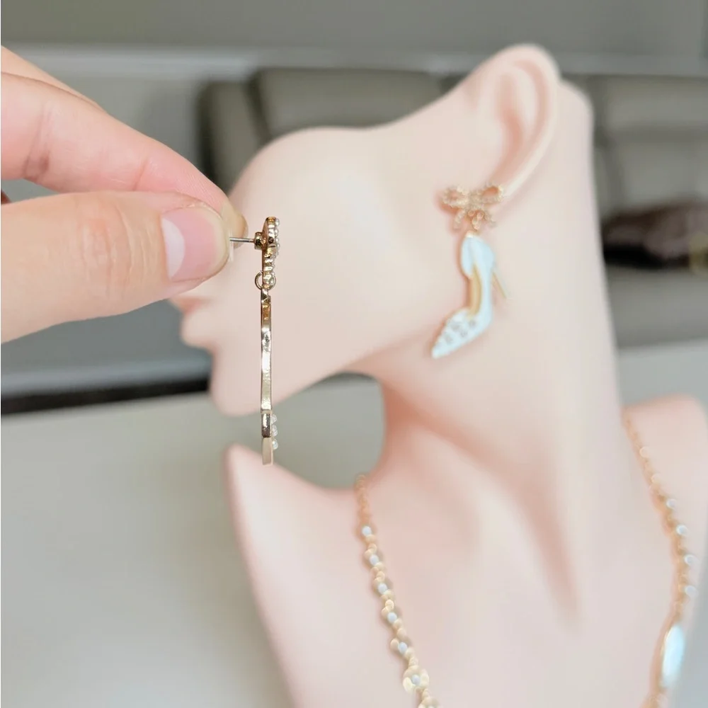 White Enamel High Heel Drop Earrings with Gold Bow